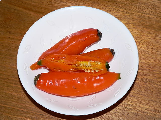 a white plate with 3 pieces of aji amarillo