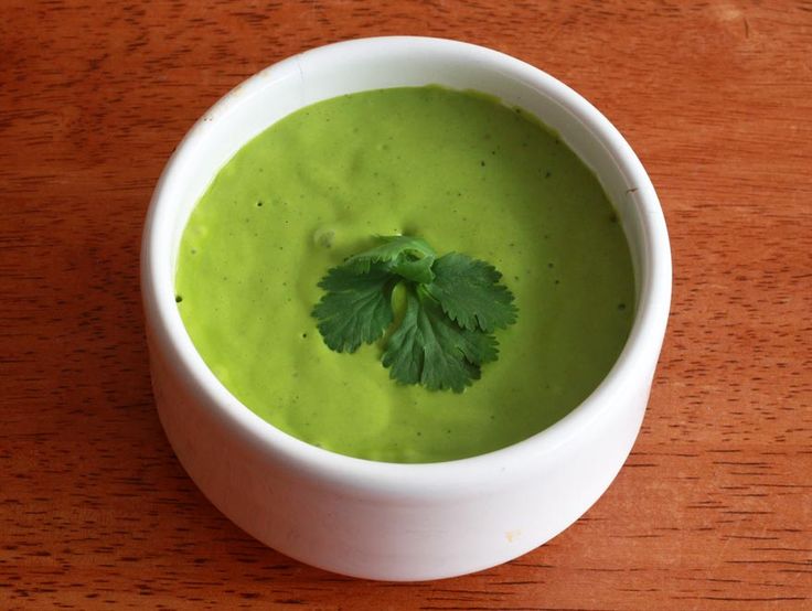 container with a huacatay cream , a green mixture