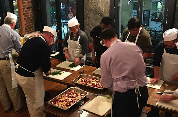 class participants cutting potatoes